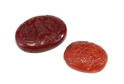 Appraisal: Two Fine Chinese amber amulets qing dynasty Of oval form