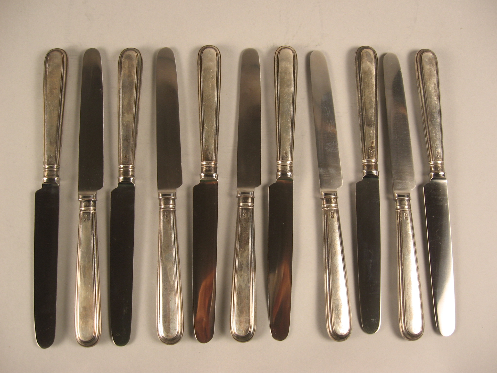 Appraisal: Set of twenty-four English sterling silver handle table knives maker's