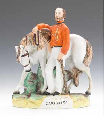 Appraisal: An Equestrian Figurine Garibaldi Depicted standing next to his horse