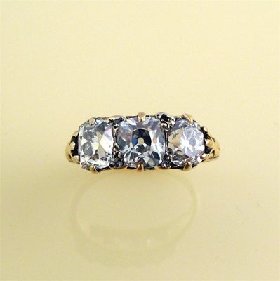 Appraisal: A Victorian diamond three stone ring set with slightly graduated