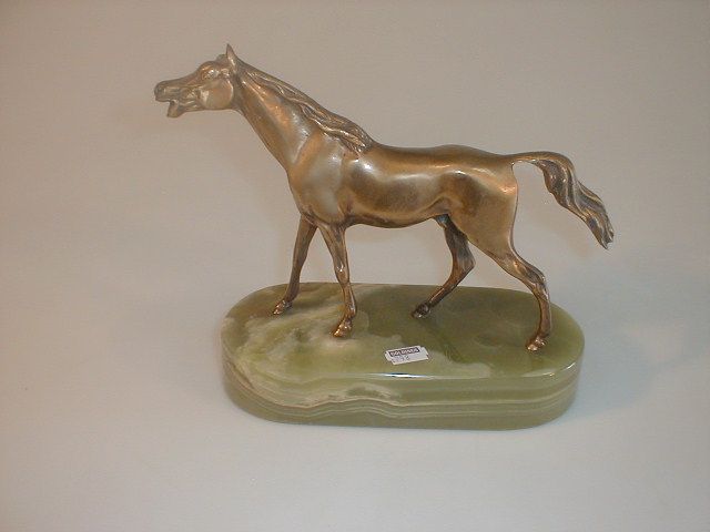 Appraisal: A cast brass figure of a stallion on an onyx