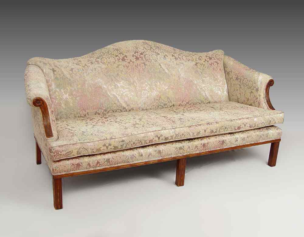 Appraisal: CHIPPENDALE CAMELBACK SOFA Carved wood arm trim and carved Chinese