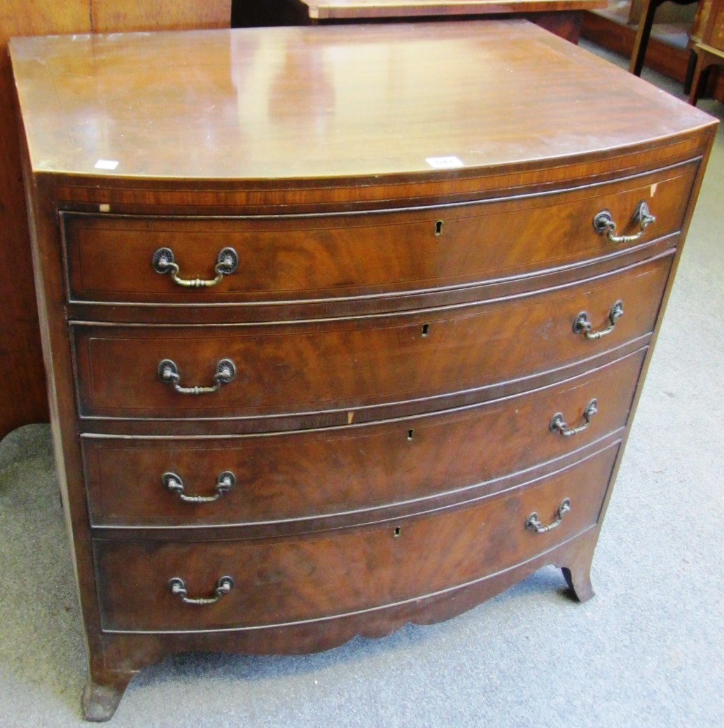 Appraisal: A Regency style inlaid mahogany bowfront chest of four long