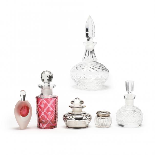 Appraisal: FIVE ASSORTED GLASS PERFUME BOTTLES AND A SMALL DRESSER JAR