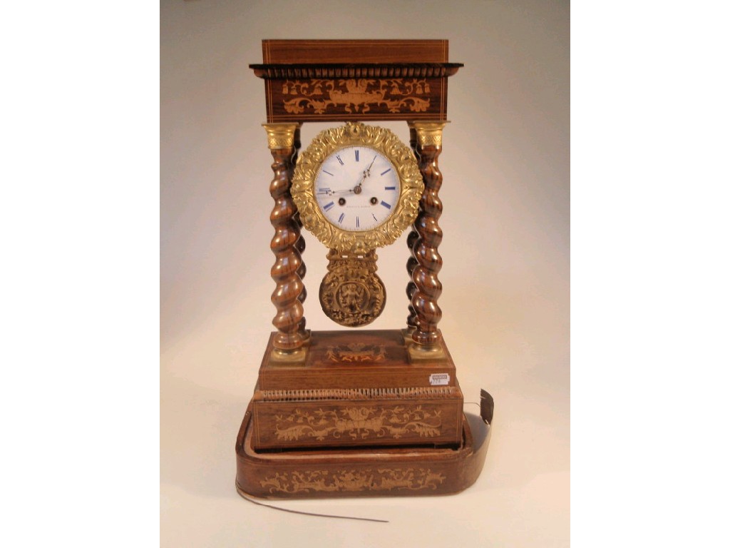 Appraisal: A thC French rosewood portico clock the enamelled eight-day movement