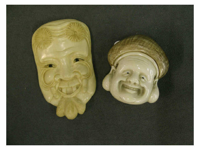 Appraisal: Two flat ivory netsuke depicting mask of Okina and Arabian