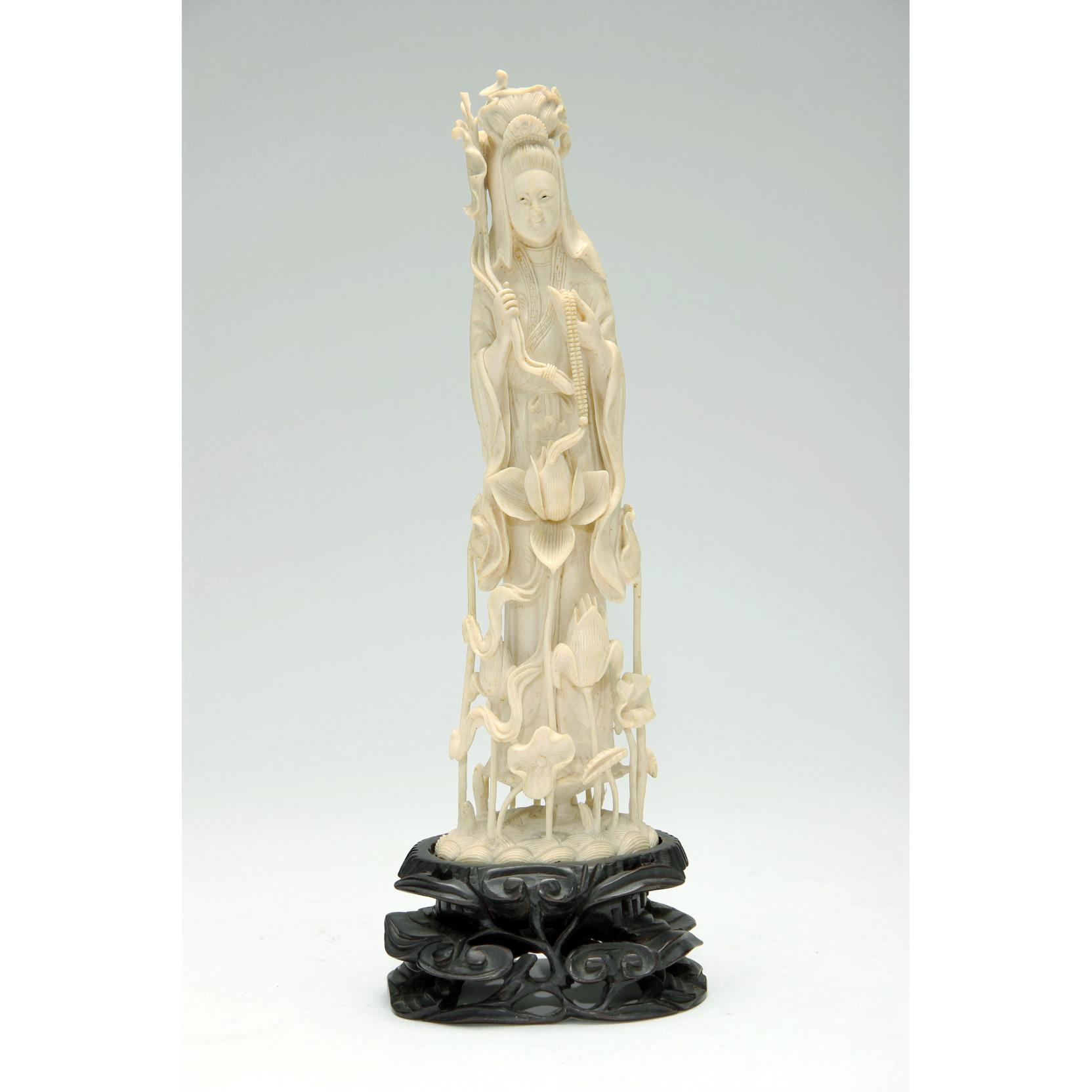 Appraisal: Chinese Ivory Statuette of Guanyin the deity amid delicately carved