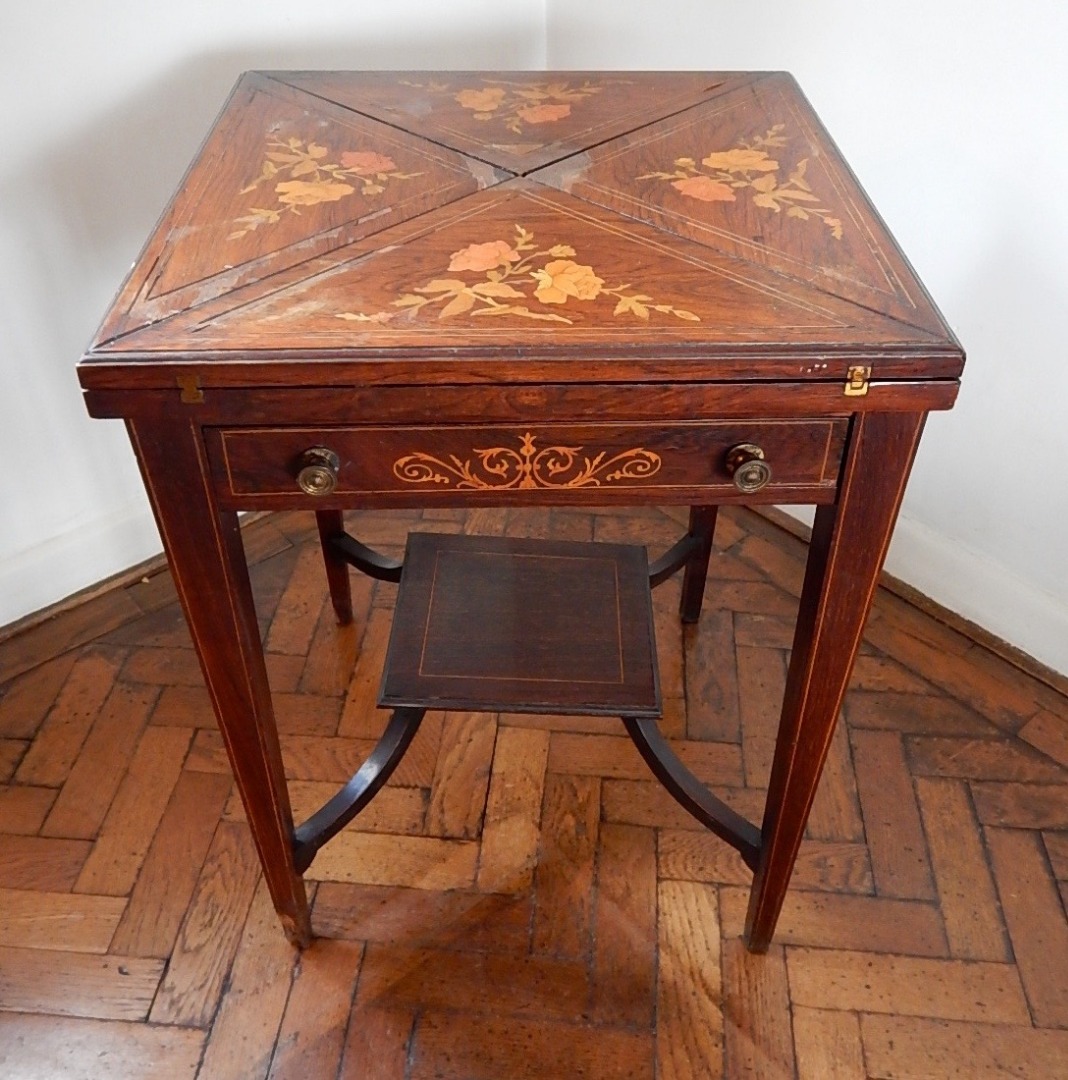 Appraisal: A late Victorian inlaid rosewood envelope card table with marquetry