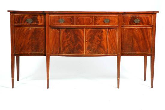 Appraisal: SIDEBOARD Mahogany serpentine front sideboard having band inlay and three