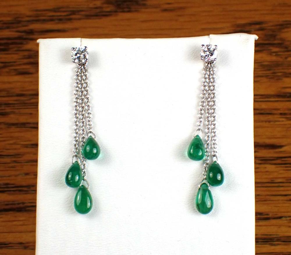 Appraisal: PAIR OF DIAMOND EAR STUDS WITH EMERALD EARRING ENHANCERS including