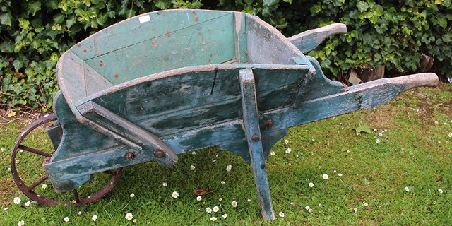 Appraisal: A LATE TH EARLY TH CENTURY GREEN PAINTED WOODEN WHEELBARROW