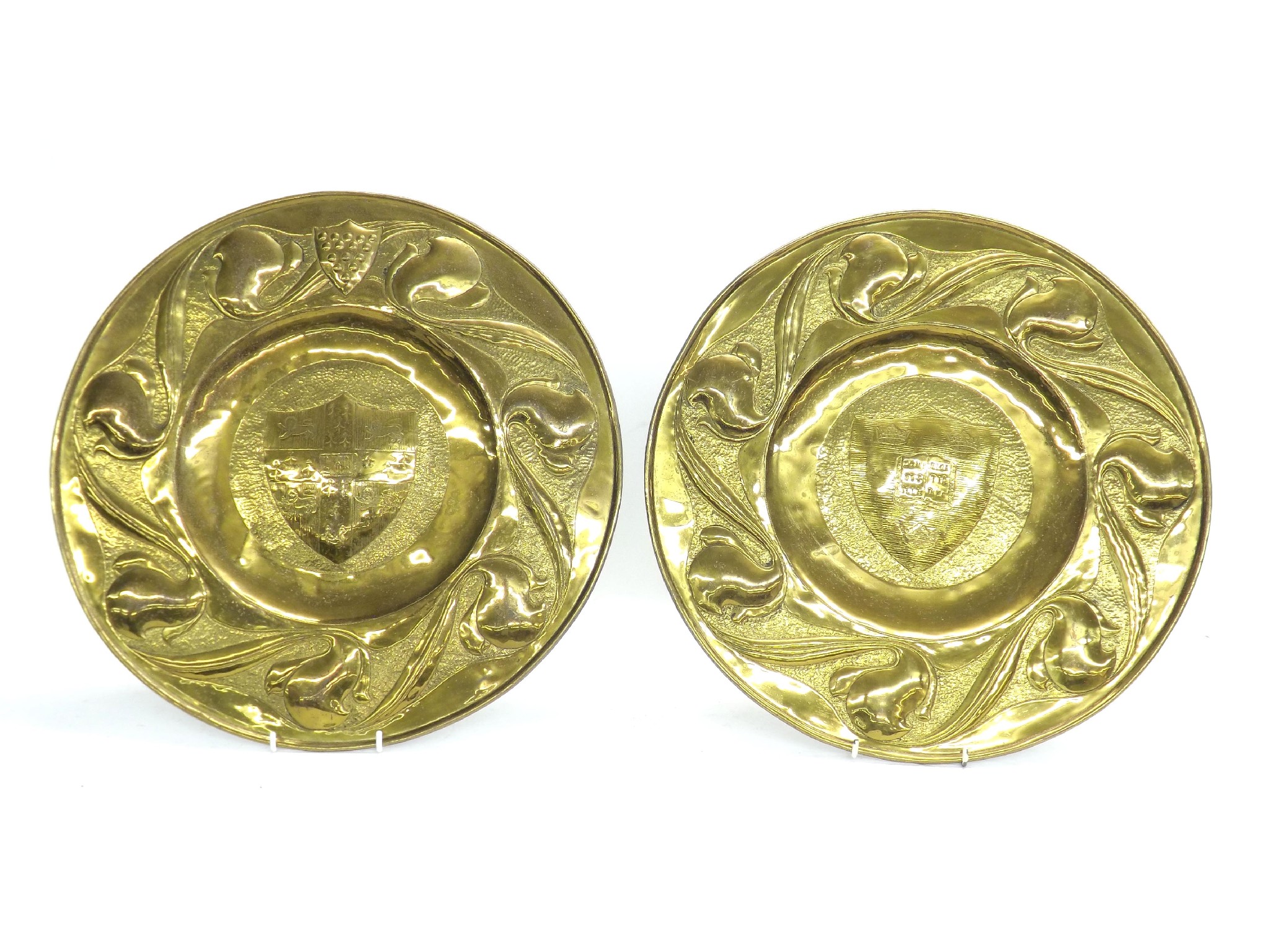 Appraisal: Two similar Arts Crafts circular embossed brass dishes with crests