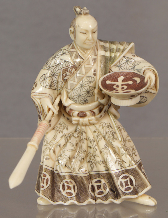 Appraisal: Japanese carved ivory figure polychromed ivory Samurai signature to base