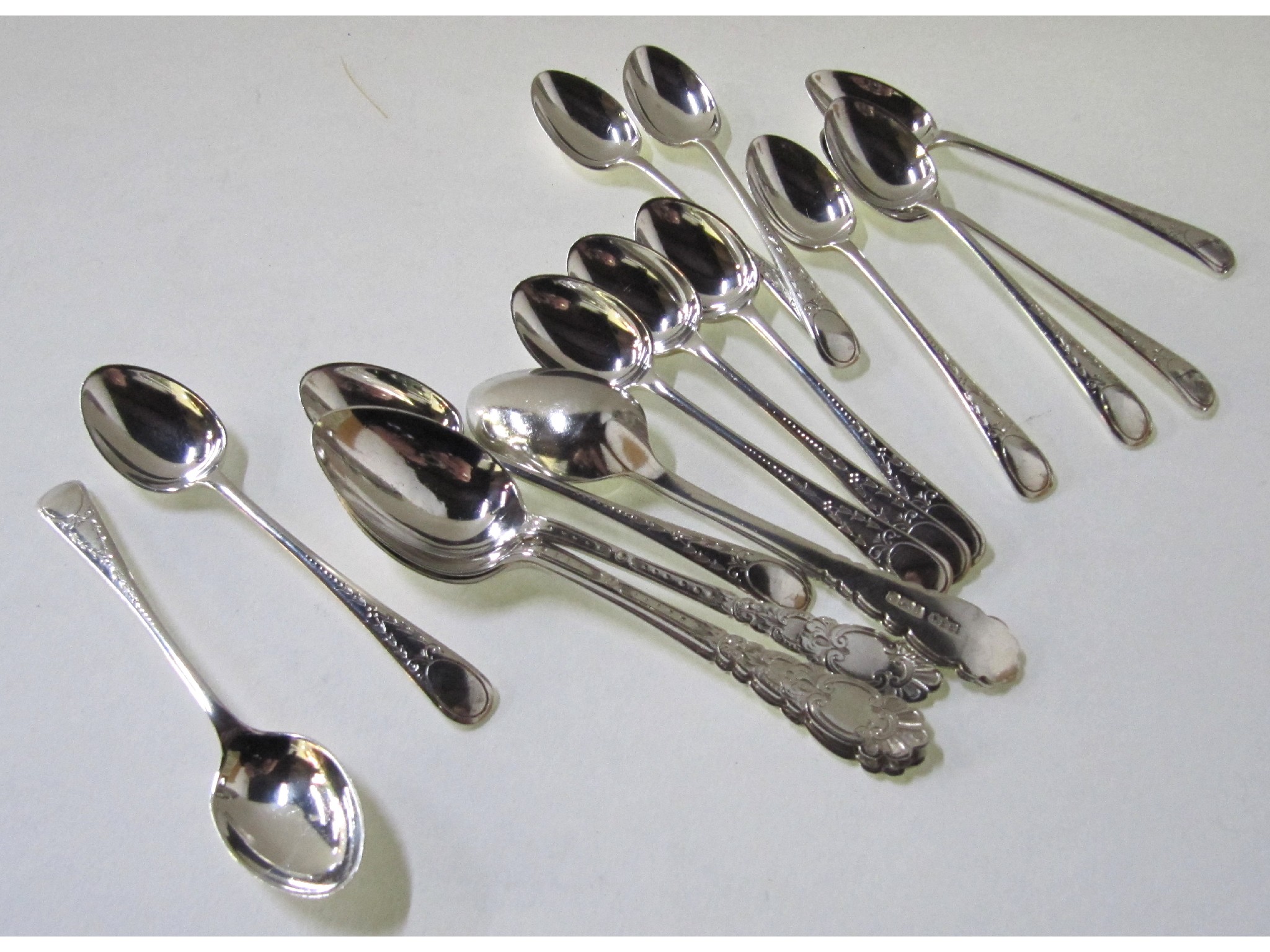 Appraisal: A lot comprising a set of twelve silver coffee spoons