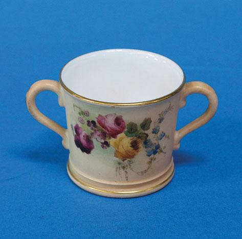 Appraisal: A ROYAL WORCESTER BLUSH IVORY MINIATURE LOVING CUP painted with