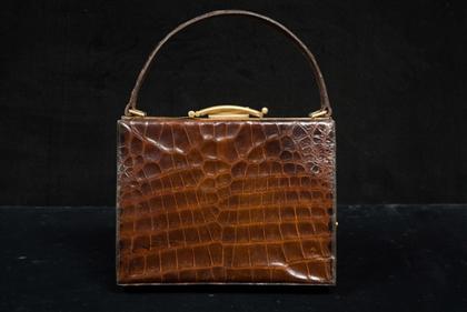 Appraisal: Alligator purse s Rich golden brown skins with a single