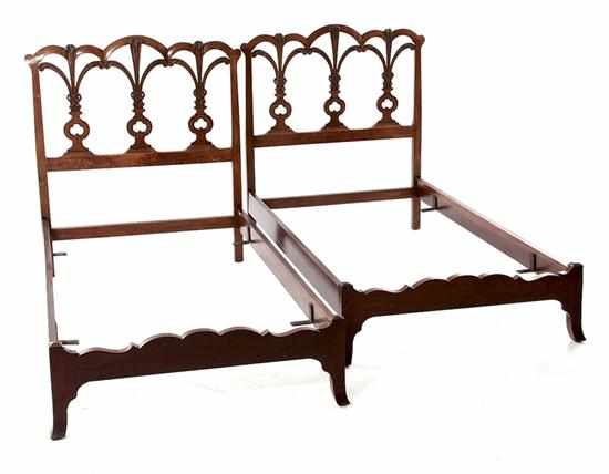 Appraisal: Pair Georgian style carved mahogany twin beds triple-arch headboard with