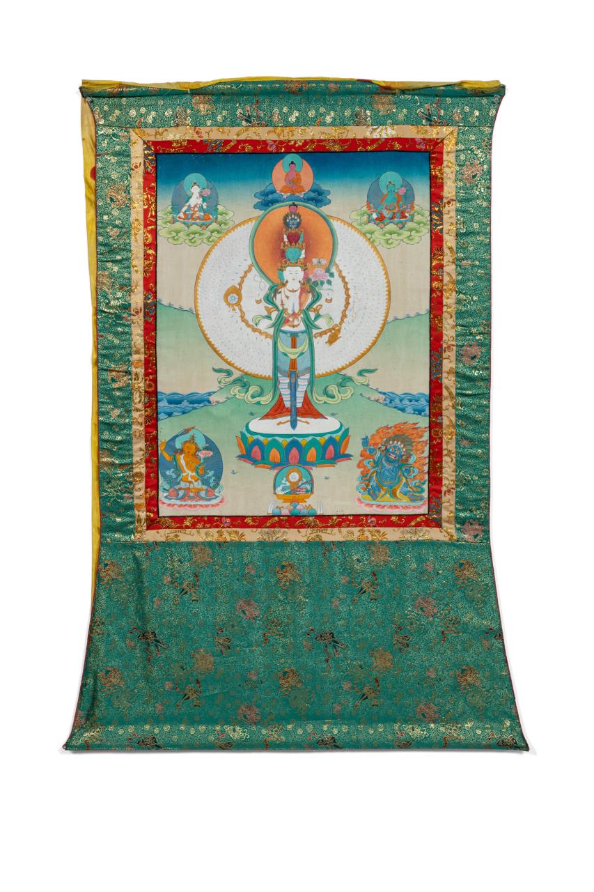 Appraisal: TIBETAN HANGING THANGKA W YELLOW SILK VEIL Tibetan hand painted