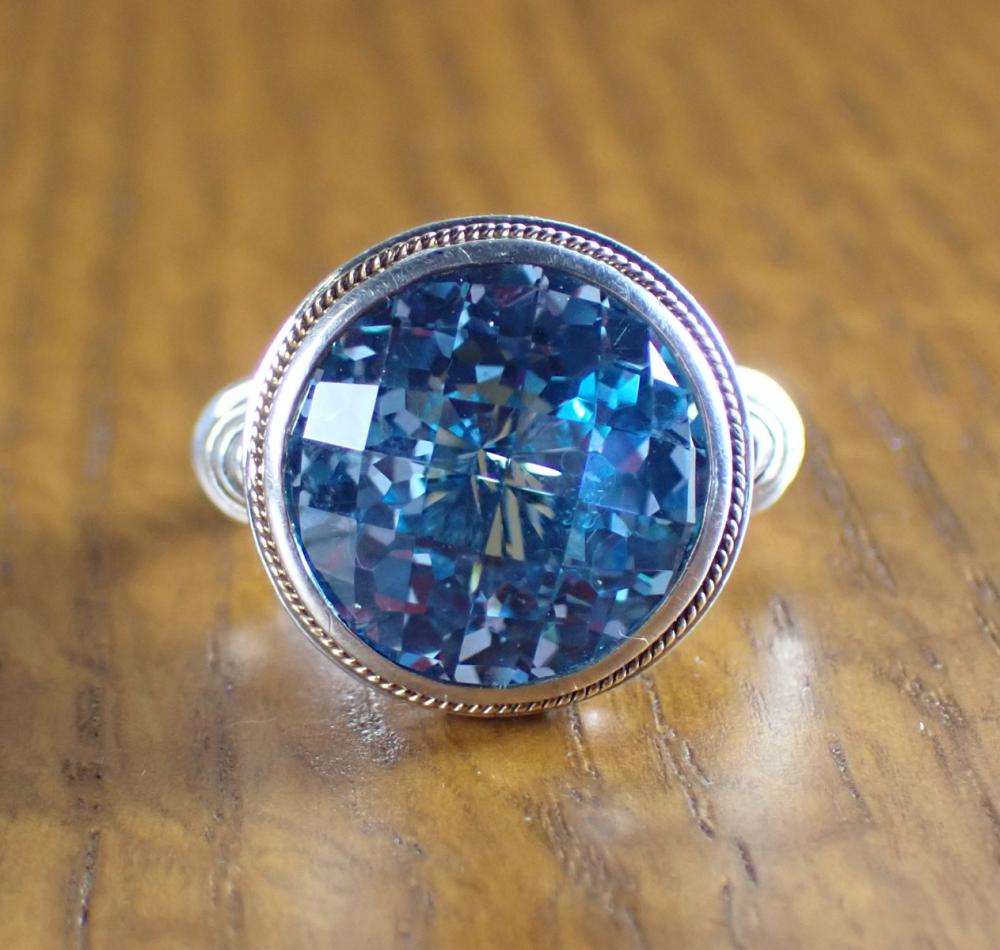 Appraisal: BLUE TOPAZ STERLING AND EIGHTEEN KARAT GOLD EFFY RING The