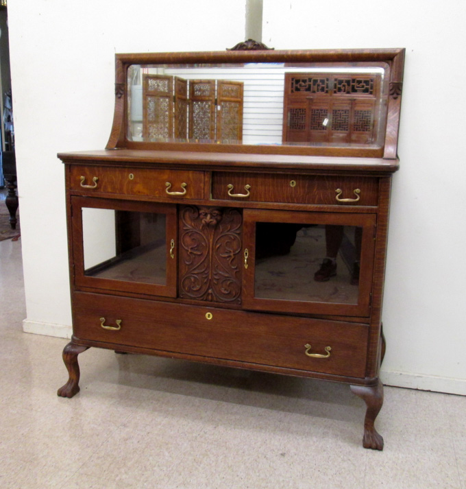 Appraisal: LATE VICTORIAN OAK CHINA BUFFET American c having a mirror