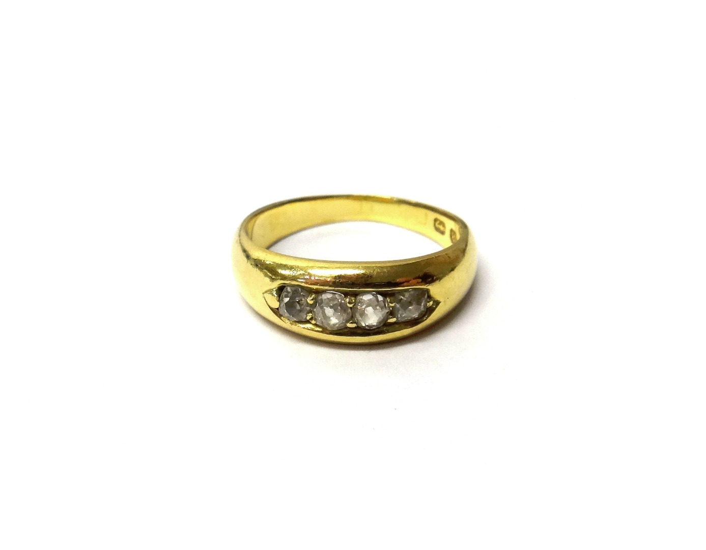 Appraisal: An ct gold ring mounted with a row of four