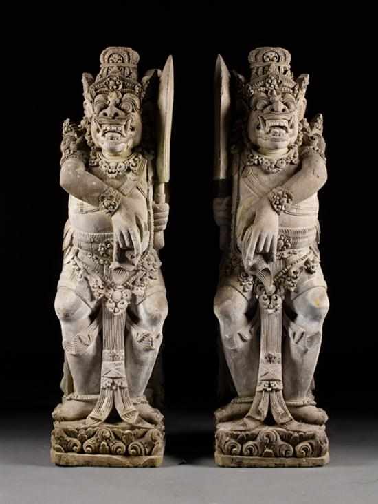 Appraisal: Pair of Thai carved lava stone deities each modeled as