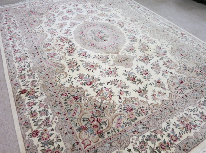 Appraisal: HAND KNOTTED ORIENTAL CARPET Indo-Persian floral and central floral medallion