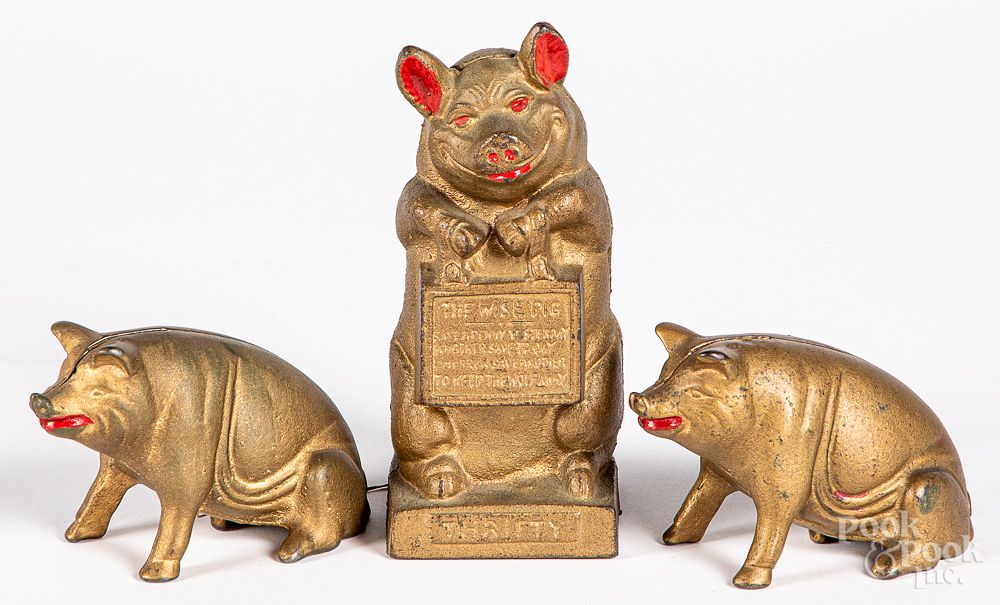 Appraisal: Three cast iron pig banks Three cast iron pig banks