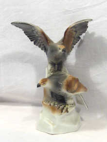 Appraisal: A porcelain model of two birds of prey cm high