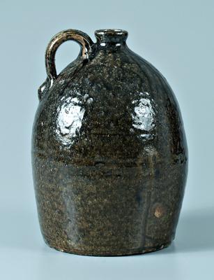 Appraisal: W Beecham stoneware jug ovoid with medium to runny olive