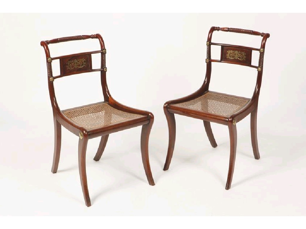 Appraisal: A PAIR OF REGENCY BRASS INLAID CHAIRS with brass mounts