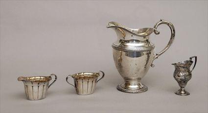 Appraisal: American Silver Water Pitcher Creamer and Sugar together with an