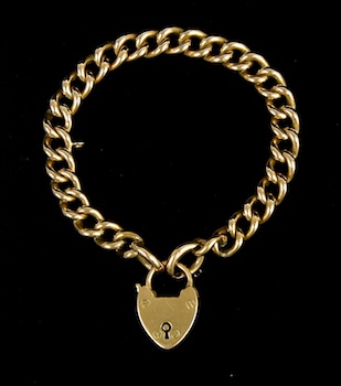 Appraisal: A k Gold Curb Link Bracelet with Heart Padlock Charm