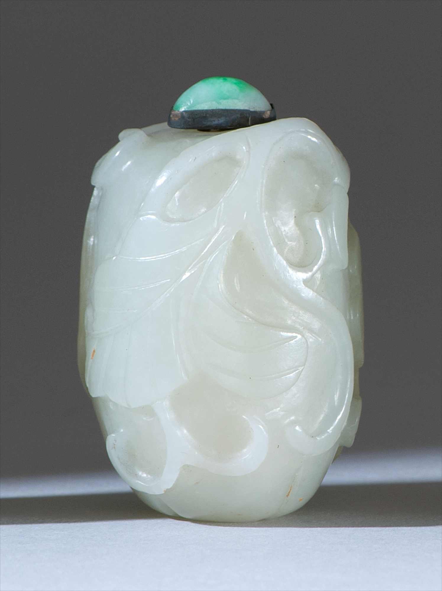 Appraisal: WHITE JADE SNUFF BOTTLE th CenturyIn melon form with relief-carved