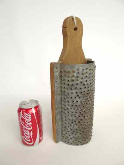 Appraisal: th c wood and tin primitive pierced grater '' Length