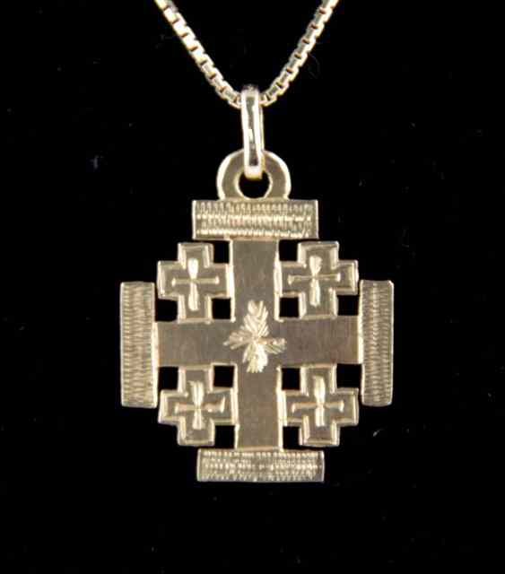 Appraisal: An K pendant of cross shape on an K chain