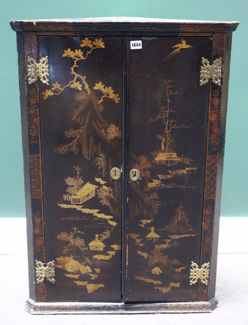 Appraisal: An th century black lacquer chinoiserie decorated hanging two door