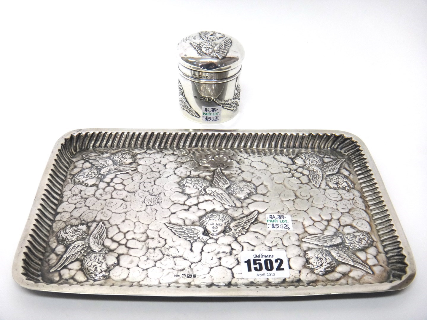 Appraisal: Silver comprising a Victorian rectangular dressing table tray embossed with