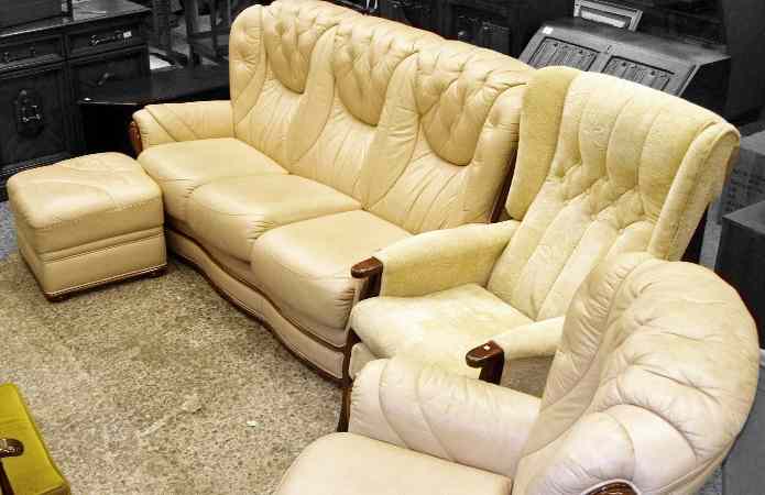 Appraisal: Cream Leather Three Seater Settee and Chair Foot Stool aand