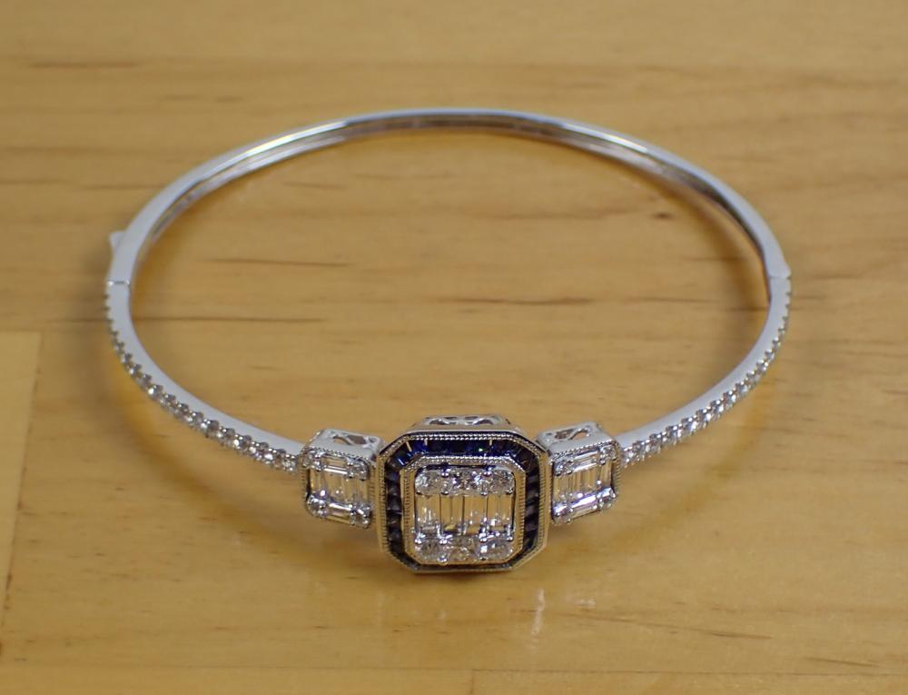 Appraisal: DIAMOND SAPPHIRE AND EIGHTEEN KARAT GOLD BANGLE The k white