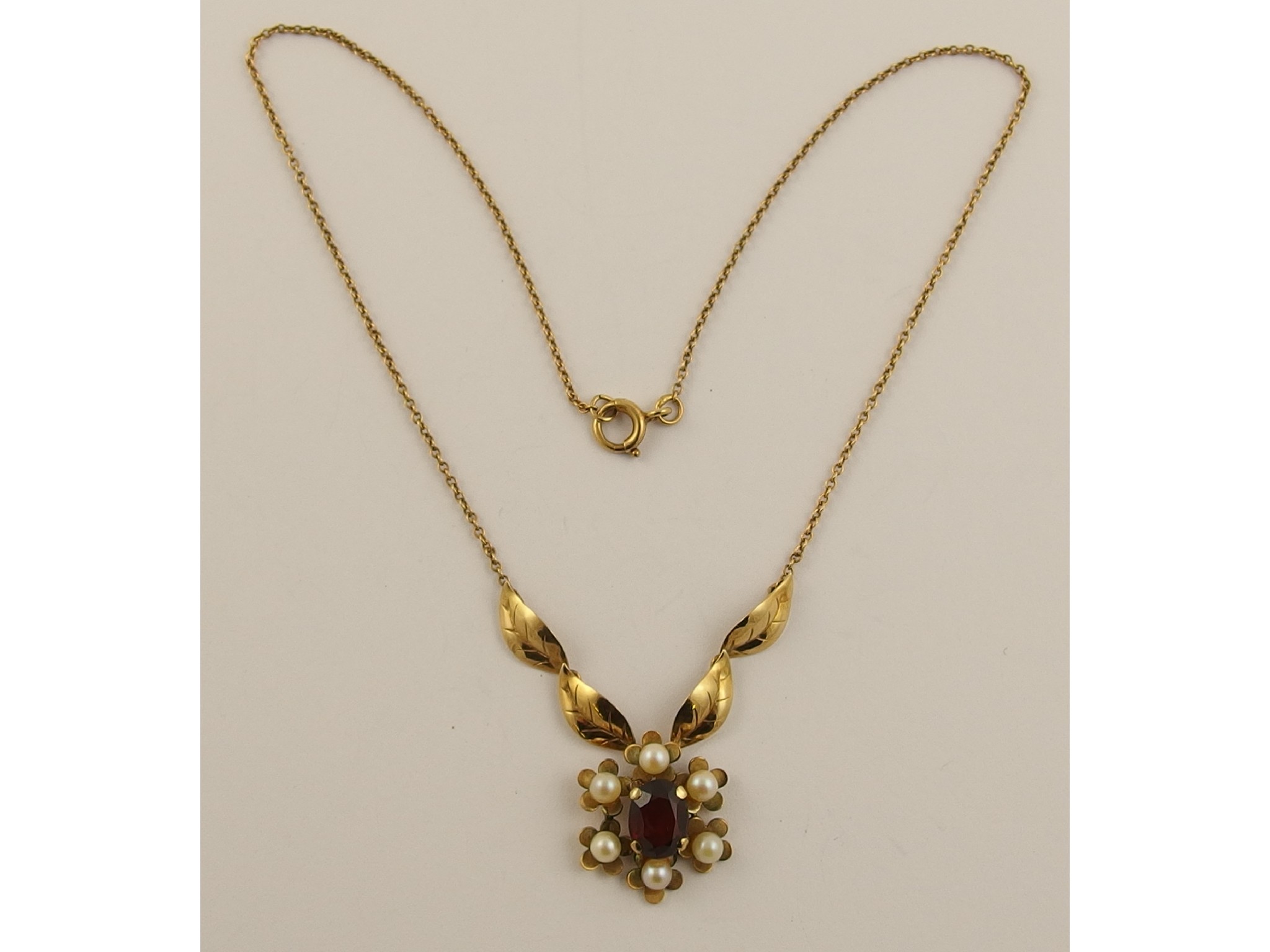 Appraisal: A ct garnet and pearl pendant necklace