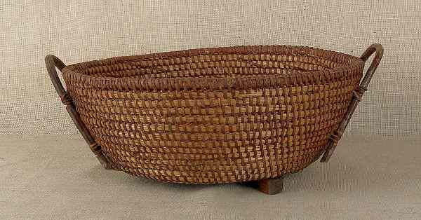 Appraisal: Pennsylvania rye straw gathering basket th c with twig handles