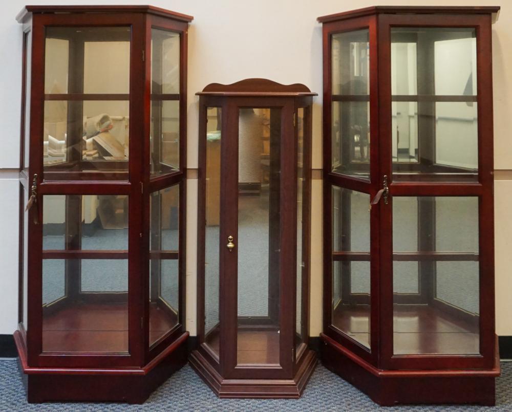 Appraisal: Pair Cherry Finish Mirror-Back Curio Cabinets and Small Curio Cabinet