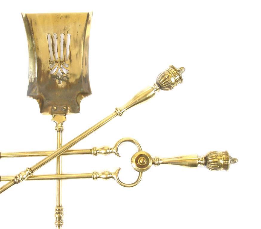 Appraisal: A set of three late Victorian brass fire tools