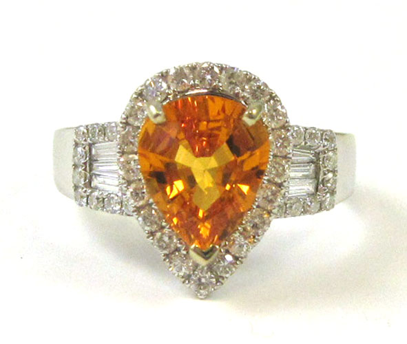 Appraisal: ORANGE SAPPHIRE AND DIAMOND RING k white gold with round-cut