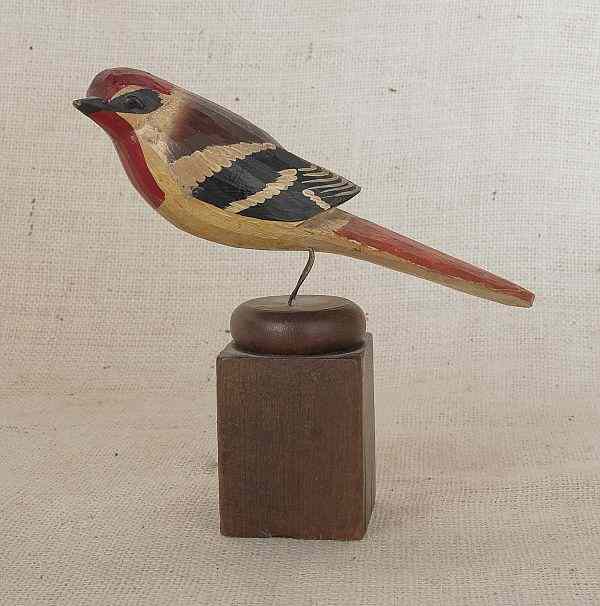 Appraisal: Carved and painted song bird on a wooden mount late