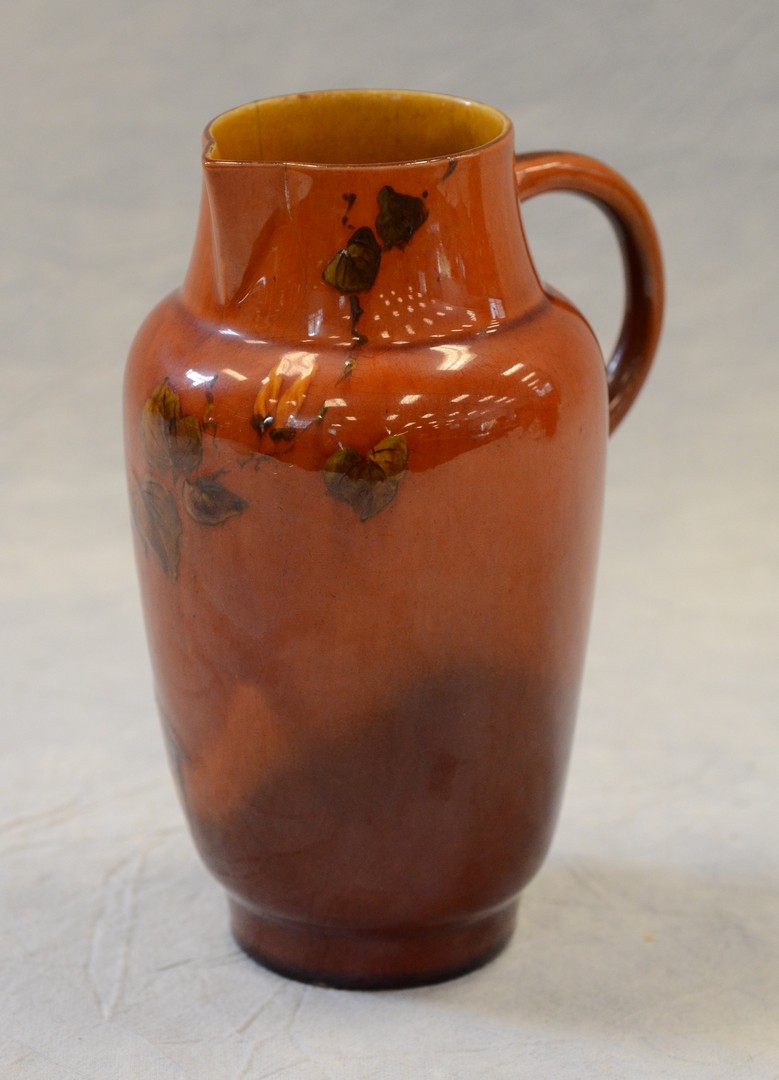 Appraisal: Rookwood Pottery standard glaze pitcher raised design Artus Van Briggle