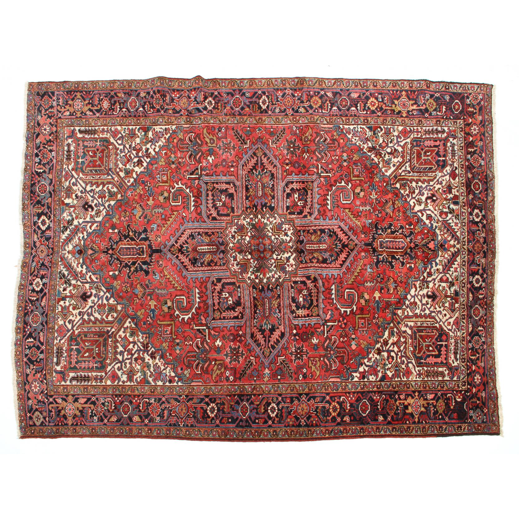 Appraisal: Persian Heriz Carpet circa with pole medallion on red field