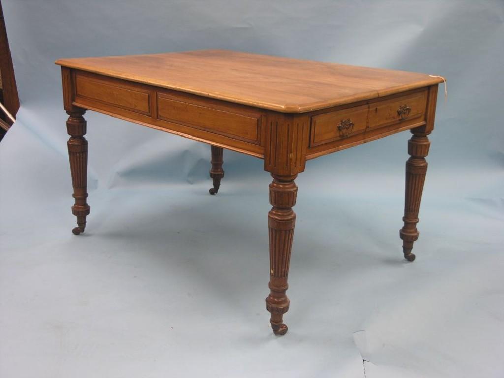 Appraisal: A Victorian walnut writing table rectangular-shape with canted corners single