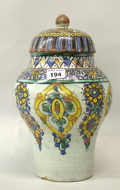 Appraisal: Early th century Moroccan pottery polychrome painted inverted baluster vase